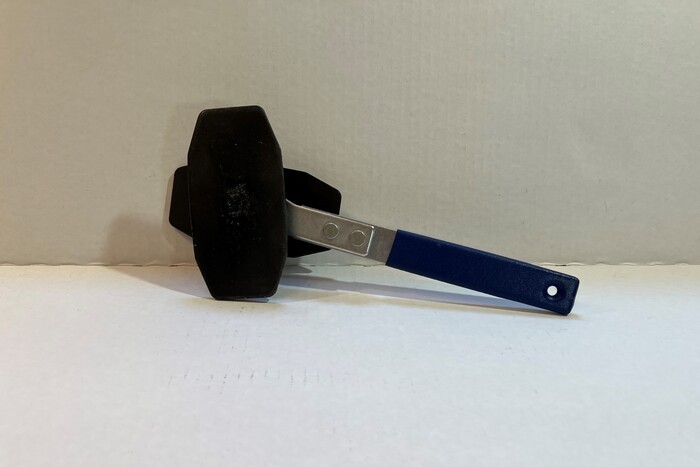 An image of car brake caliper tool